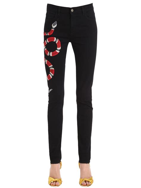 gucci snake jeans women.